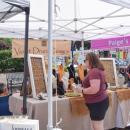 An attendee explores a jewelry booth. 