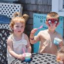 Dylan, 2, and Luka, 4, enjoy a free kiddie ice cream. 