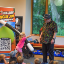 Ivy laughs at Jungle Jim after performing a magic trick. 