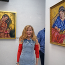 Deborah Macy poses with a couple of her paintings. Photos by Kat Sheridan