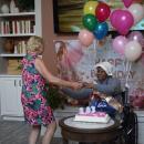 Nellie Jackson dances with one of the staff members. 