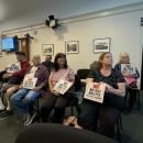 Residents with their signs. Photo by Kat Sheridan