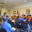 The room was filled and overflowing for the debate. 