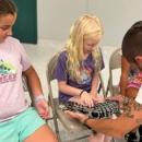 A camper holda a snake. Source: Humane Society and Shelter Southcoast Facebook