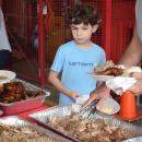 Adam, 8, debates if he wants some chicken. 