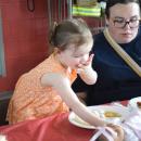 Magnolia Seland, age 2, enjoys the pulled pork. 