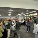 The new teachers, School Committee and mentors mingle. 