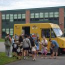 Kids line up for ice cream. 