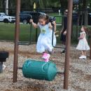 Claire, 5, runs on a playground toy.