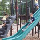Conner, 6, slides down the slide. 