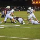 A Dartmouth player attempts to get the ball away from a Bishop Stang player. 