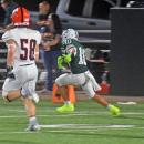 Chace Afonso runs with the ball. 