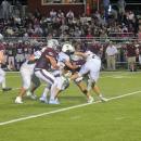 A Bishop Stang player gets tackled. 