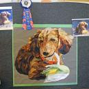 A quilt showing one of Nina's dachshunds. 