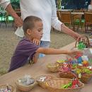 Samuel, 7, looks at the prizes. 