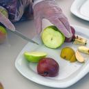 Joseph from Ingoldsby Orchards cuts some apples for tasting. 