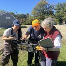 Members of the Mass Audubon Society match the ducks to the people who sponsored them. 