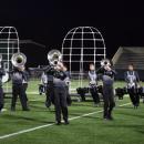The wind section marches across the field. 