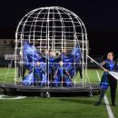 The color guard inside the cage. 