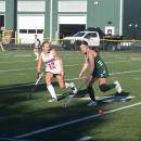 A Dartmouth and Barnstable player race for the ball. 