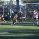A number of players head for the ball. 