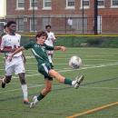 Casey Martinho keeps the ball from going out of bounds. Photos by Kat Sheridan