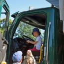 Bo, age 3, enjoys one of the DPW trucks. 