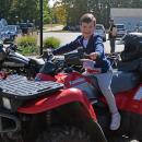 Theodore Nelson, age 3, gets to try out a (stationary) motorcycle. 