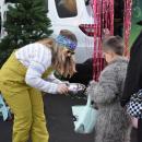 Jessica Dastous hands some candy to Sean (6) dressed as the big bad wolf. 