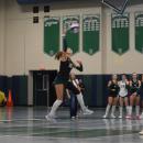 Kasey Pomfret leaps to hit the ball. 