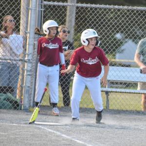 The Cardinals’ Joe Albernaz reacts to his hit as he runs to first base.
