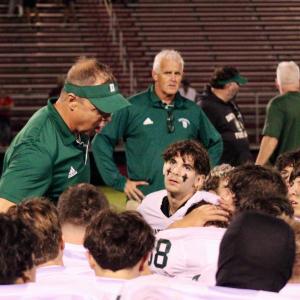 Head coach Richard White talks to the team after their win. Photos by Brandy Muz 