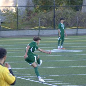 A teammate kicks the ball back into play. 