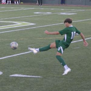 Caleb DaSilva kicks the ball. 