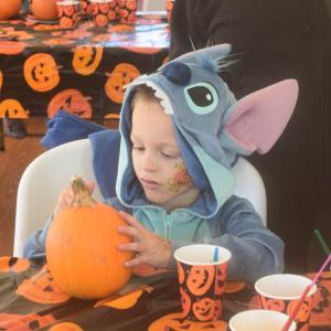 Josia Raposa paints a pumpkin.  Josia Raposa paints a pumpkin.