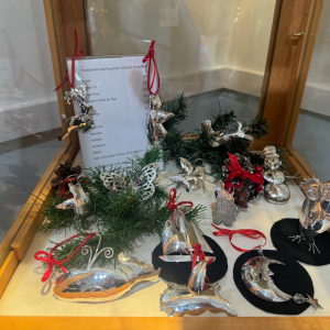 Metal ornaments available in the gallery.