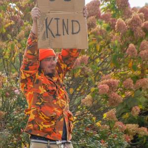 Nathan Bean holds his sign. Photos by Mari Huglin