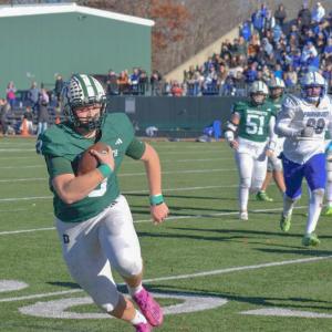 Aiden Gendron runs with the ball to attempt a touchdown. Photos by Kat Sheridan