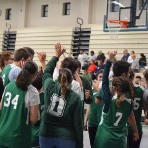 The team ends their season with a cheer. Photos by Kat Sheridan