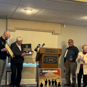 Robert Mayo receives a set of pins from Matthew Briouillette of the Veteran's Service Board. Photos by Kat Sheridan