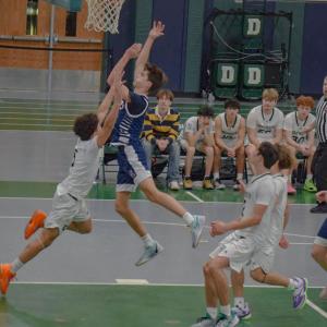 Julian Raymond blocks another player. Photos by Kat Sheridan