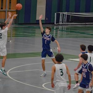 James Gilberg attempts a three-pointer.