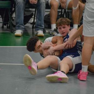 Jace Pina wrestles for the ball.