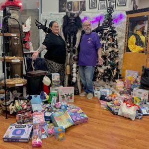 Co-owners Florrie Steele and Max Diamond pose with Krampus and the presents.