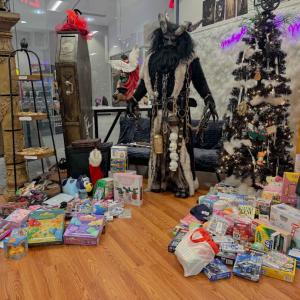 Krampus poses with all the toys raised. Photos by Kat Sheridan