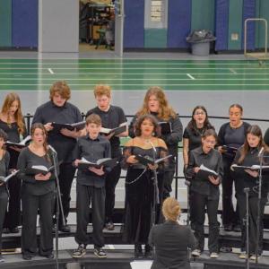 The chorus carols for the season.