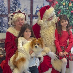 Emma and Sophia Diorio with their dog Nemo get the perfect picture. Photos by Kat Sheridan