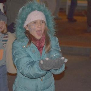 Aurea Wilson, 10, catches a bubble.