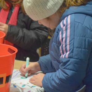 Harper Silva, 9, writes a letter to Santa.