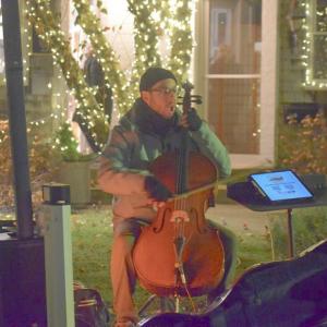 The Punk Cellist plays for those visiting the village. 